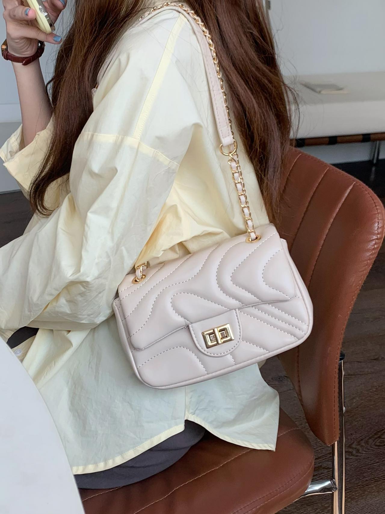Elegant Cream Quilted Shoulder Bag With Golden Accents